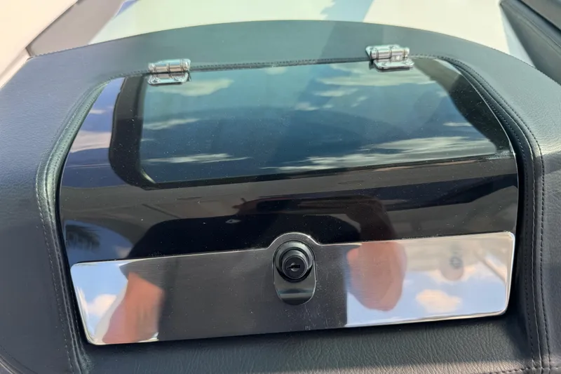 Slide: The Image of Dashboard compartment of 2024 Chaparral 280 OSX boat with reflective surface. - 74