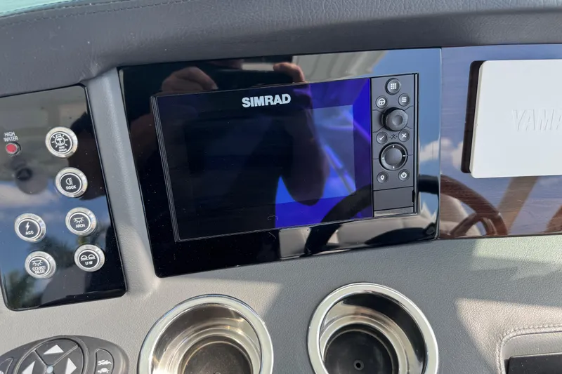 Slide: The Image of Dashboard of 2024 Chaparral 280 OSX with Simrad display and Yamaha controls. - 76