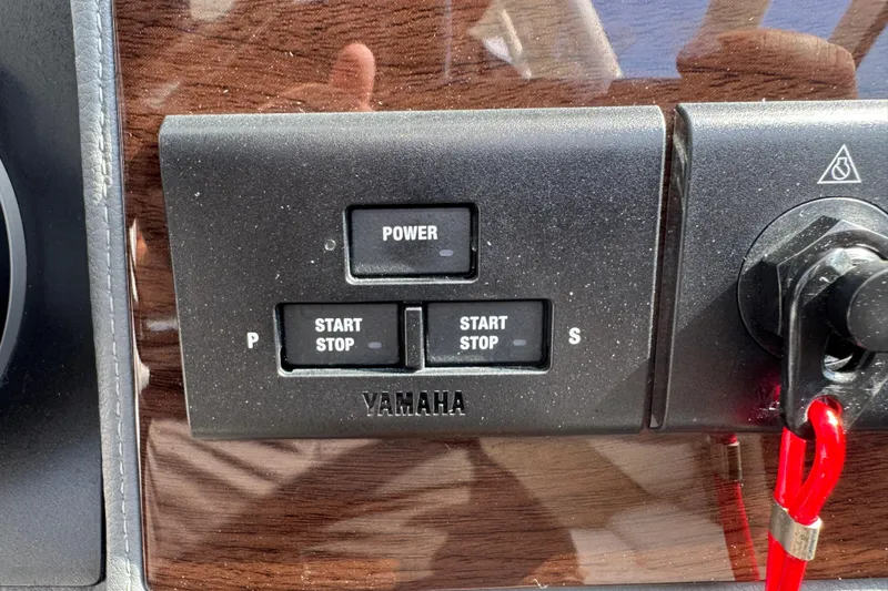 Slide: The Image of Control panel of 2024 Chaparral 280 OSX with Yamaha start-stop buttons. - 78