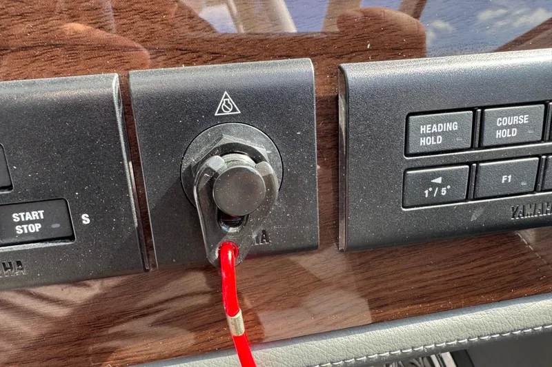 Slide: The Image of Control panel of 2024 Chaparral 280 OSX boat with start/stop and navigation buttons. - 79