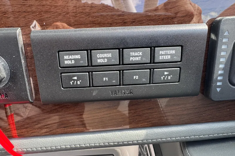Slide: The Image of Control panel of 2024 Chaparral 280 OSX boat with Yamaha navigation buttons. - 80