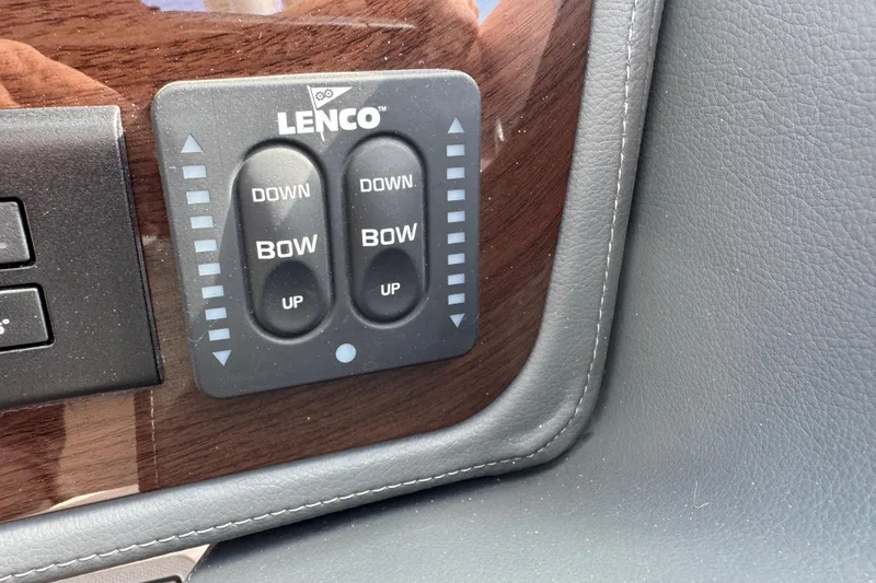 Slide: The Image of Lenco trim tab controls on 2024 Chaparral 280 OSX boat dashboard. - 81