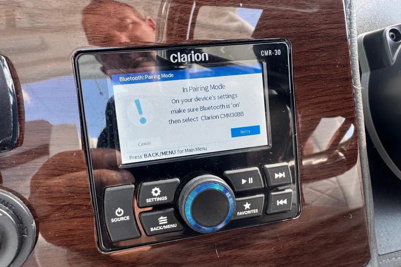 Slide: The Image of Bluetooth pairing screen on 2024 Chaparral 280 OSX boat's Clarion audio system. - 84