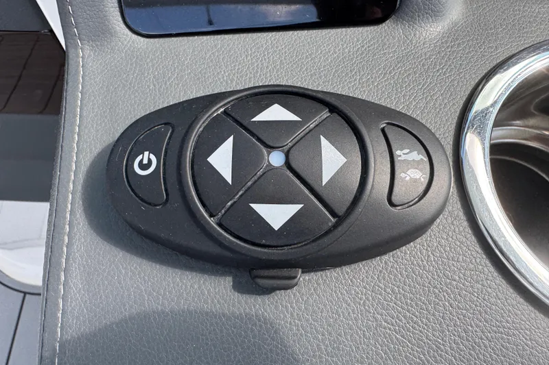 Slide: The Image of Control panel on 2024 Chaparral 280 OSX boat dashboard with directional buttons. - 86