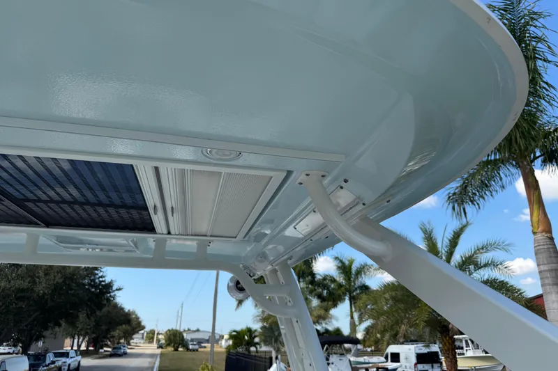 Slide: The Image of 2024 Chaparral 280 OSX boat roof detail with palm trees in background. - 89