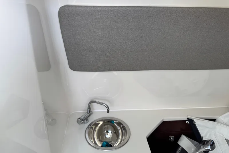 Slide: The Image of 2024 Chaparral 280 OSX interior sink with modern design and storage space. - 91