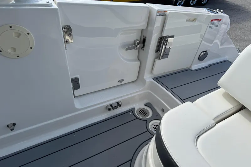 Slide: The Image of 2024 Chaparral 280 OSX boat interior, featuring sleek seating and modern deck design. - 94