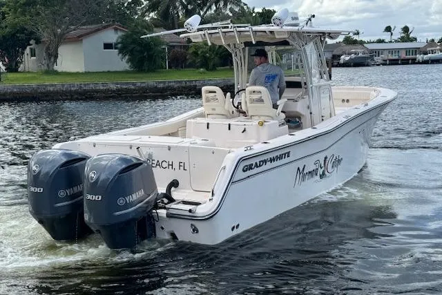 The Image of 2007 Grady-White Bimini 306 boat with twin Yamaha engines cruising on a waterway. - 0