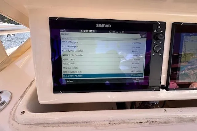 Slide: The Image of Simrad navigation display on 2007 Grady-White Bimini 306 boat dashboard. - 15