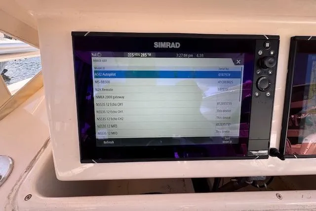 Slide: The Image of Simrad navigation display on 2007 Grady-White Bimini 306 boat dashboard. - 16