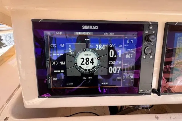 Slide: The Image of Simrad navigation display on 2007 Grady-White Bimini 306 boat, showing heading and speed data. - 19