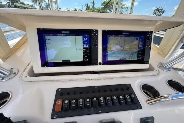 Slide: The Image of Control panel of 2007 Grady-White Bimini 306 boat with dual Simrad displays. - 23