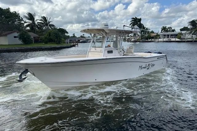 Slide: The Image of 2007 Grady-White Bimini 306 boat cruising on a scenic waterway. - 3