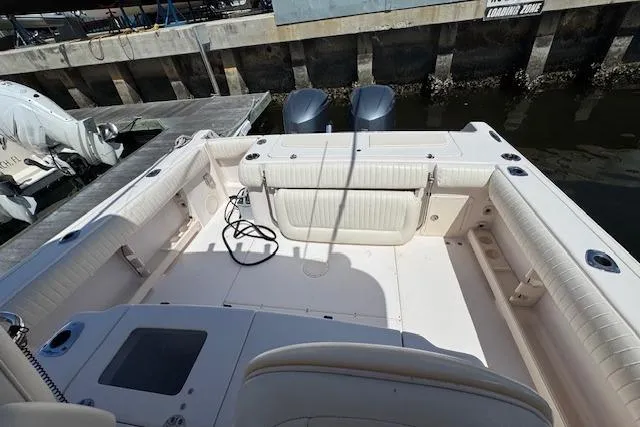 Slide: The Image of 2007 Grady-White Bimini 306 boat interior with twin engines at dock. - 30
