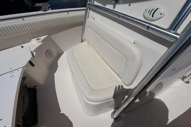 Slide: The Image of 2007 Grady-White Bimini 306 boat interior with cushioned seating and stainless steel railing. - 31