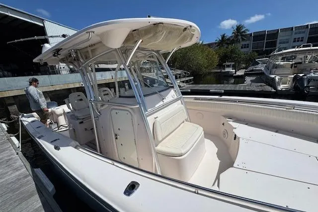 Slide: The Image of 2007 Grady-White Bimini 306 boat docked, featuring spacious seating and sleek design. - 38