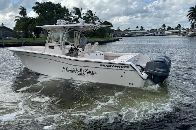 Slide: The Image of 2007 Grady-White Bimini 306 boat cruising on a calm waterway. - 5