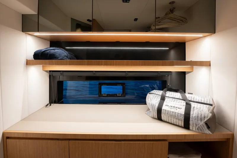 Slide: The Image of Luxurious interior of 2026 De Antonio Yachts D60 with sleek storage and modern design. - 25