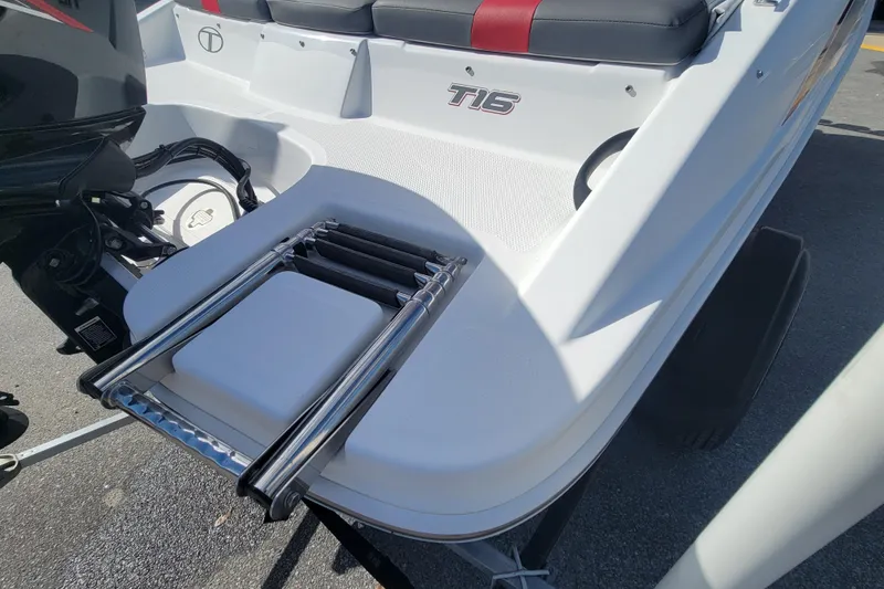 Slide: The Image of 2022 Tahoe T16 boat with foldable ladder and seating area. - 13