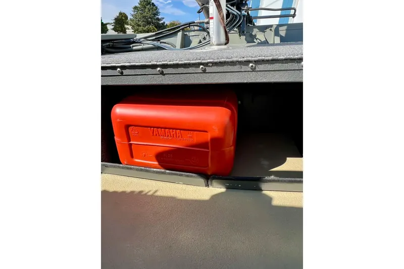 Slide: The Image of 2004 MirroCraft 1876 Outfitter boat with Yamaha fuel tank storage. - 17