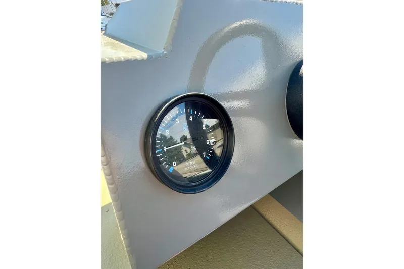 Slide: The Image of Close-up of RPM gauge on 2004 MirroCraft 1876 Outfitter boat dashboard. - 19
