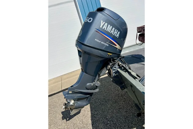 Slide: The Image of Yamaha 60 horsepower four-stroke outboard motor on 2004 MirroCraft 1876 Outfitter boat. - 6