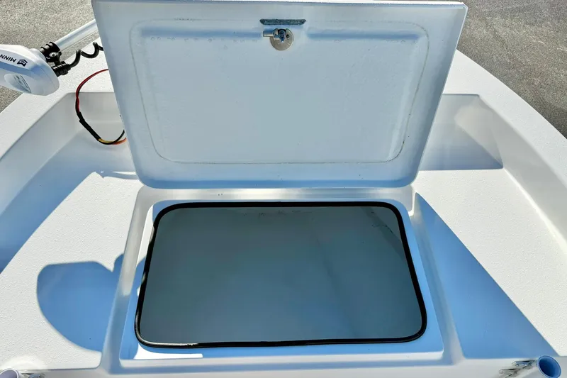 Slide: The Image of Open storage compartment on 2024 Lookout Bay 19 boat deck. - 13