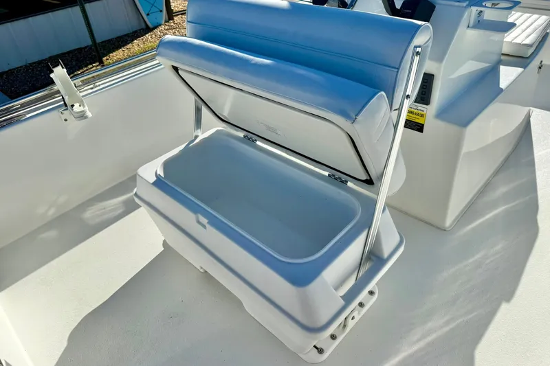 Slide: The Image of Open storage compartment on 2024 Lookout Bay 19 boat, featuring white cushioned seating. - 20