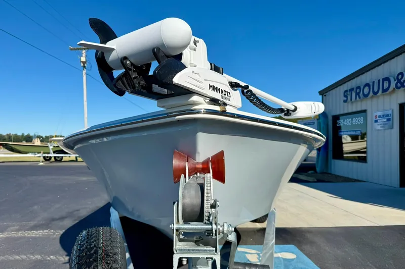Slide: The Image of 2024 Lookout Bay 19 boat with Minn Kota motor, parked outside Stroud & Co. dealership. - 7