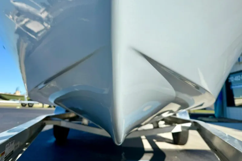 Slide: The Image of Close-up of 2024 Lookout Bay 19 boat hull on trailer. - 8