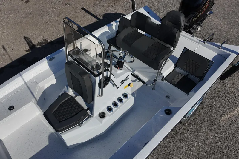 Slide: The Image of 2026 Xpress H20B Bay boat interior with seating and steering console. - 10