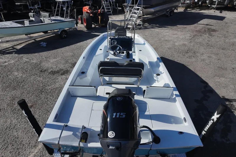Slide: The Image of 2026 Xpress H20B Bay boat with 115 horsepower engine, parked outdoors. - 13