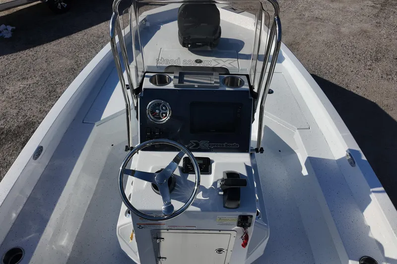 Slide: The Image of 2026 Xpress H20B Bay boat interior with steering console and controls. - 15