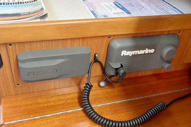 Slide: The Image of Control panel of 2017 Catalina boat featuring Raymarine and Fusion equipment. - 19