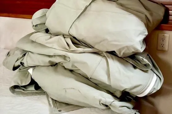 Slide: The Image of Pile of beige jackets on a bed, 2017 Catalina model. - 29