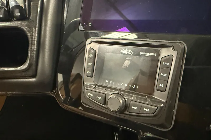 Slide: The Image of 2026 Bentley Pontoons Elite 253 dashboard with Wet Sounds audio system. - 10