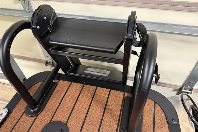 Slide: The Image of 2026 Bentley Pontoons Elite 253 Swingback Dual Capt ladder detail in a garage setting. - 15