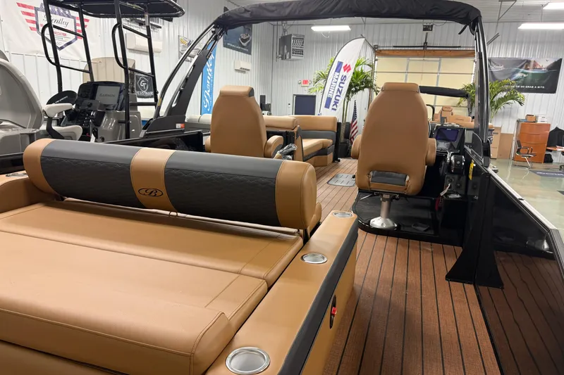 Slide: The Image of 2026 Bentley Pontoons Elite 253 Swingback Dual Capt interior with luxurious seating and modern design. - 16