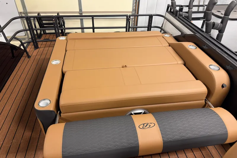 Slide: The Image of 2026 Bentley Pontoons Elite 253 Swingback Dual Capt with tan seating and cup holders. - 20