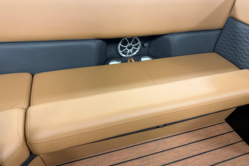 Slide: The Image of Luxurious tan seating with speaker detail in 2026 Bentley Pontoons Elite 253 Swingback Dual Capt. - 24