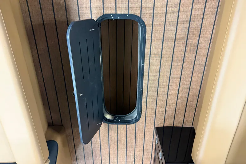 Slide: The Image of Open hatch on 2026 Bentley Pontoons Elite 253 Swingback Dual Capt, showcasing interior design. - 6