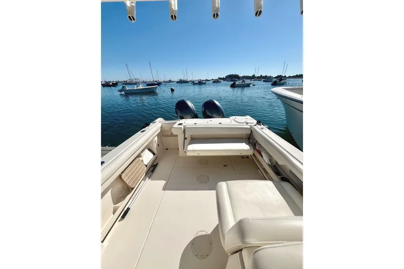 Slide: The Image of 2018 Grady-White Freedom 275 boat interior with scenic harbor view. - 14