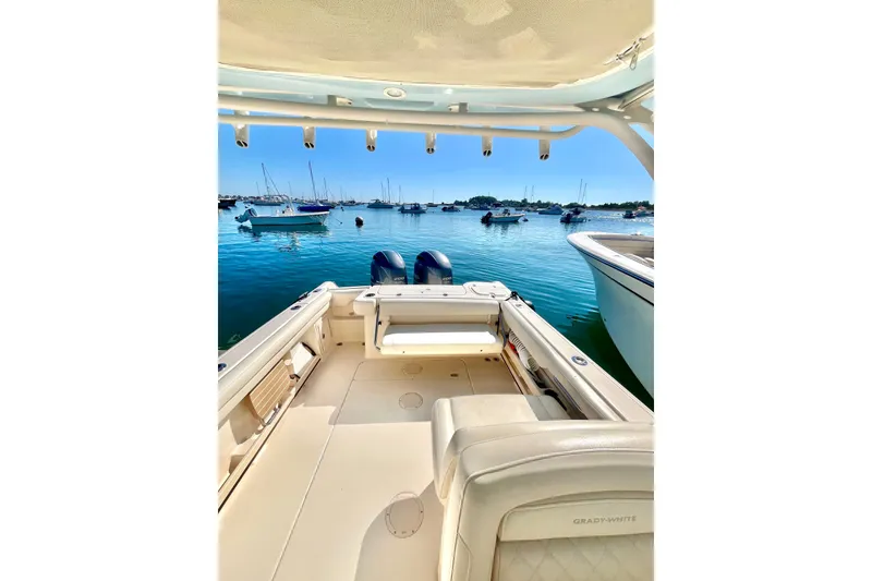 Slide: The Image of 2018 Grady-White Freedom 275 boat interior with scenic harbor view. - 30