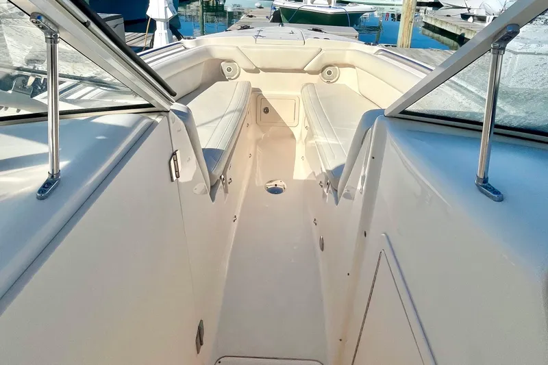 Slide: The Image of 2018 Grady-White Freedom 275 boat interior with seating and open deck view. - 32