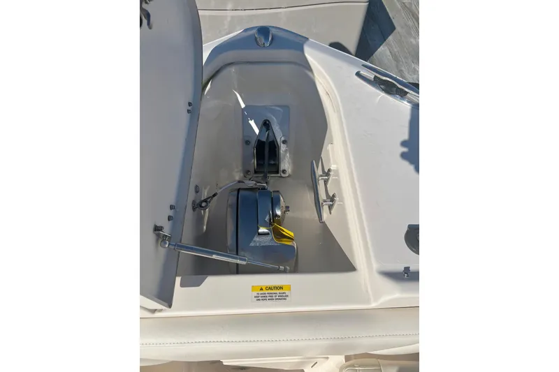 Slide: The Image of 2018 Grady-White Freedom 275 boat anchor compartment with open hatch. - 47