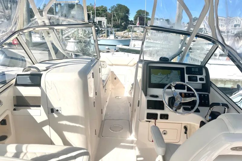 Slide: The Image of 2018 Grady-White Freedom 275 boat interior with modern dashboard and steering wheel. - 48
