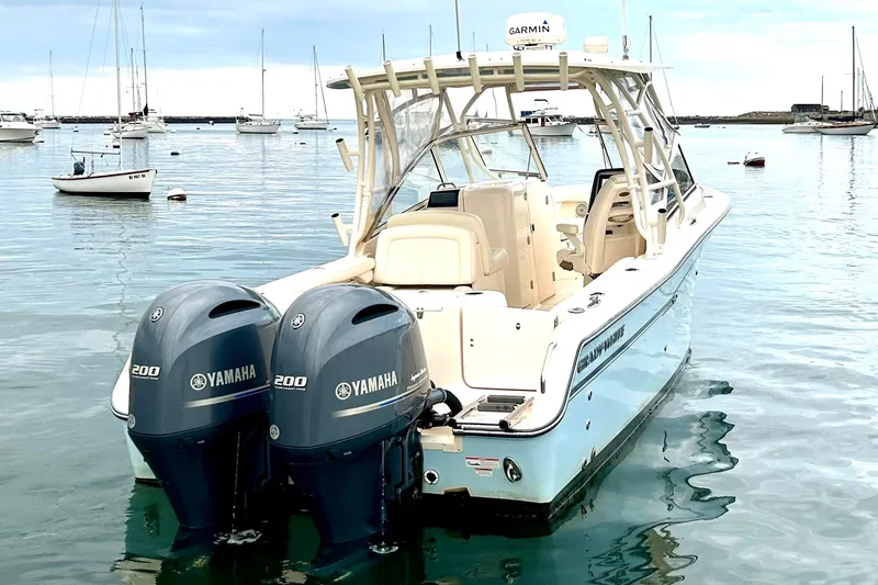 Slide: The Image of 2018 Grady-White Freedom 275 boat with twin Yamaha 200 engines on calm water. - 5