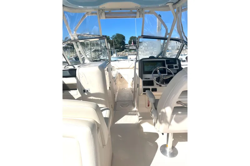 Slide: The Image of 2018 Grady-White Freedom 275 boat interior with helm and seating. - 50