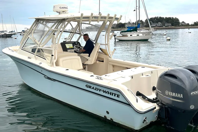 Slide: The Image of 2018 Grady-White Freedom 275 boat with Yamaha engines on calm water. - 7