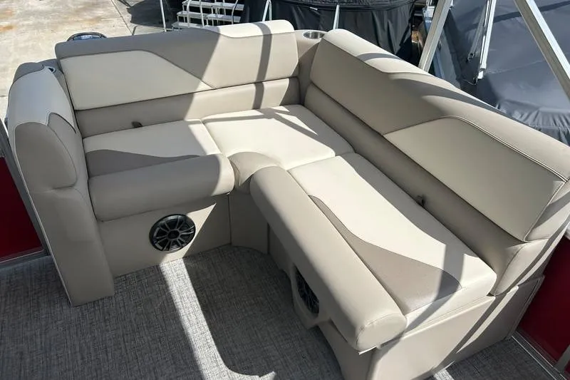 Slide: The Image of 2025 Avalon VENTURE CRUISE boat interior with beige seating and integrated speakers. - 4